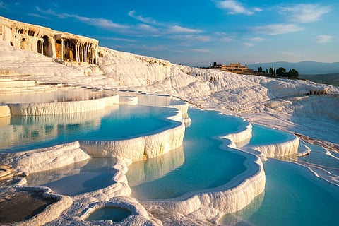 How can Turkey’s Pamukkale pools form rounded white terraces?