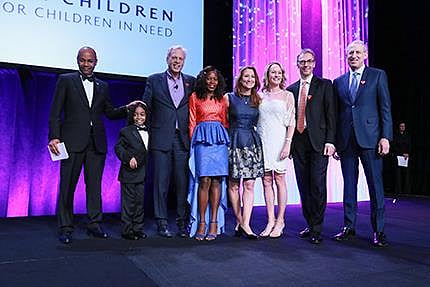 Eight year-old Caesar (2nd from left) who played violin at the event and whose wish to meet Itzhak Perlman was granted by Make-A-Wish America.