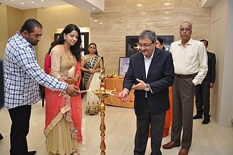Shrikant Zaveri(MD, TBZ-The Original) lighting the lamp along with Gorden Serrao (Son of Mr&Mrs Serrao) and Karen Serrao (Daughter-in –law of Mr & Mrs Serrao) at TBZ-The Original Vashi showroom