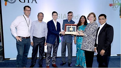 Praveenshankar Pandya, Chairman of the GJEPC, presented a plaque commemorating the 10th anniversary of the GIA India laboratory to Susan Jacques, GIA President and CEO and Tom Moses, GIA Executive Vice President and Chief Laboratory and Research Officer. Pictured (left to right) are: Matt Hall, GIA Vice President for Regional Laboratory Operations (Europe, Middle East and Africa); Russell Mehta, Managing Director of Rosy Blue (India); Tom Moses; Praveenshankar Pandya; Nirupa Bhatt, Managing Director for GIA India and Middle East; Susan Jacques; Sriram Natarajan, Vice President of Operations, GIA India laboratory.