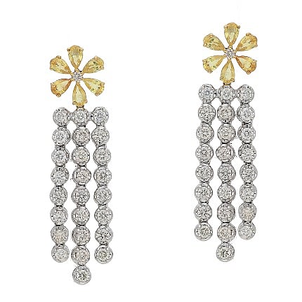 Tassel earrings curated in 14 K gold studded with fine-cut diamonds and yellow sapphire by Aisshpra Gems & Jewels.
