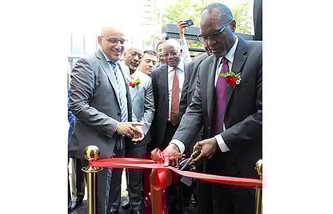 Mines and energy minister Tom Alweendo (right) surrounded by KGK Group representatives and invited guests, is pictured officially opening the KGK Group's diamond cutting and polishing factory last Friday in Windhoek.