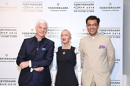 Sophia, the social humanoid, poses with Mr. Stephen Lussier, CEO Forevermark and Mr Sachin Jain, President Forevermark India