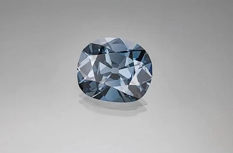 One of the most famous coloured diamonds in the world is the Hope diamond, a natural colour Fancy dark grayish blue diamond. The Hope diamond was graded in 1988 by a team of GIA gemologists. Photo by Robert Weldon © GIA. Courtesy of Smithsonian Institution.