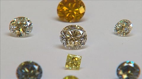 Synthetic diamonds at De Beers' Institute of Diamond Grading. Dubai will host the world's first auction of such stones. Reuters