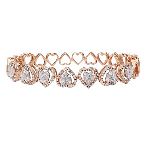 Heart bracelet crafted in 18-carat rose gold by Entice, KGK Since 1905, features heart cut white diamonds