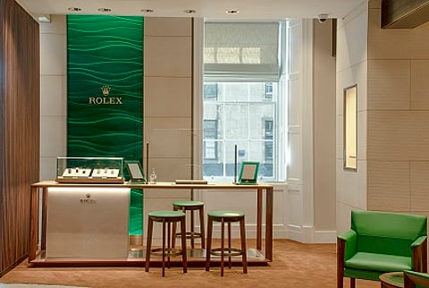 Laings Edinburgh Rolex shop-in-shop welcomes clients with the rich emerald green and gold associated with the iconic brand