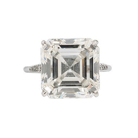 Platinum and Diamond Solitaire, prong-set with a square emerald-cut diamond weighing 10.90 cts., size 6 3/4.