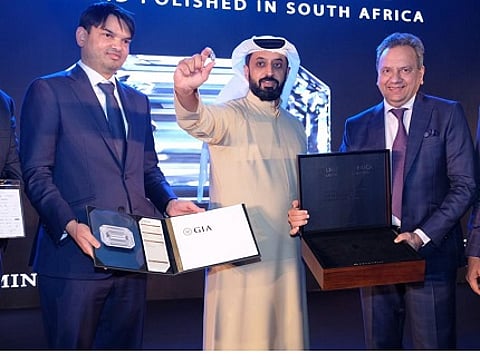 Ahmed Bin Sulayem, Executive Chairman, and CEO, DMCC holds The Light of Africa a 103.49-carat polished diamond