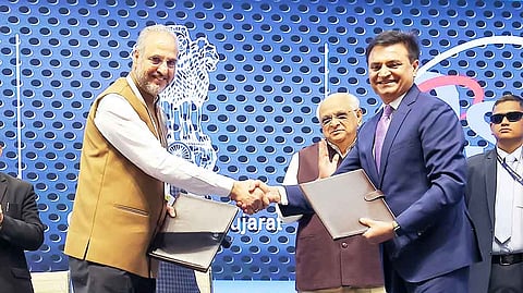 Gursharan Singh, Sr. VP of Micron (in the left) exchanges the MoU with Sanjay Sharma, NAMTECH Board member (in the right), in the presence of Gujarat Chief Minister Bhupendrabhai Patel at the Vibrant Gujarat 2024 summit