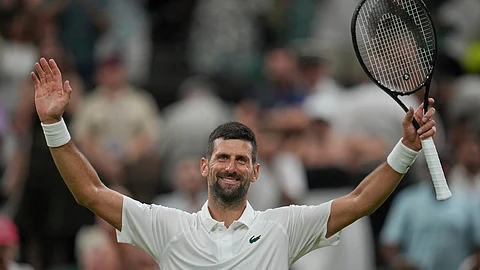 Novak Djokovic of Serbia celebrates after beating Alexandre Muller of France in their first round men's singles match at the Wimbledon Tennis Championships in London,
