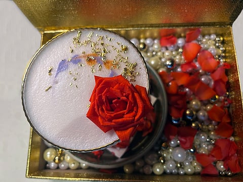 Cocktail of Juice of Dragon Fruit, St. Germain, Ouzo, garnished with fresh red rose at Shangri-La Hotel Toronto. Photo by Sara Waxman/DINE magazine