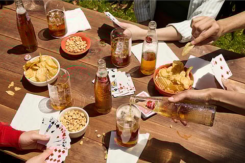 People enjoying drinks and snacks. Photo by Sidral Mundet, unsplash