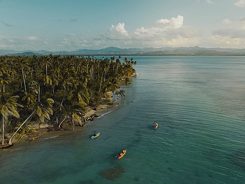 An aerial view of Michès Playa Esmeralda reveals the untouched coastline and tranquil waters that set the tone for Club Med’s wellness-driven approach to restorative travel