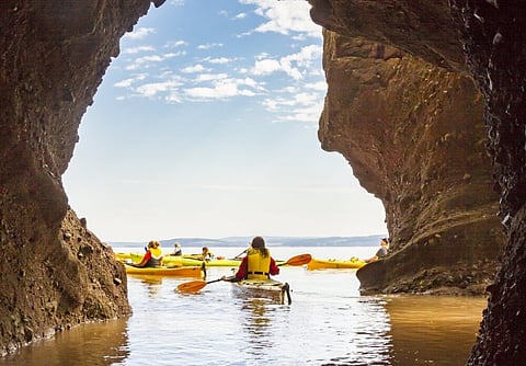 Kayaking at the Hopewell Rocks. Photo by Lindberg. Courtesy of Tourism New Brunswick