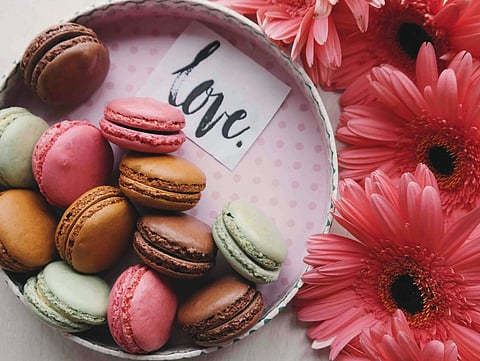 Macarons and Flowers. Photo by Brigitte Tohm_unsplash