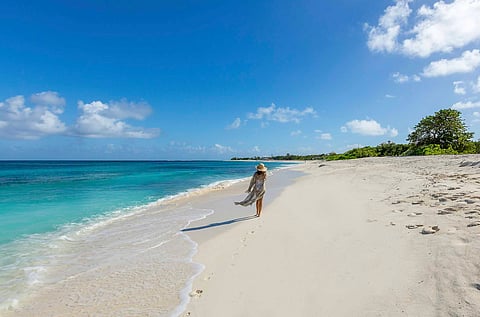 Strolling on the beach in Anguilla. Photo Courtesy of Visit Anguilla.