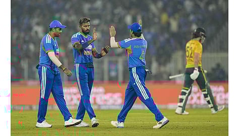 India's Hardik Pandya, centre, with teammates celebrates the wicket of South Africa's Dewald Brevis during the fifth T20 International cricket match of a series between India and South Africa, at Narendra Modi Stadium in Ahmedabad, Friday, Dec. 19, 2025