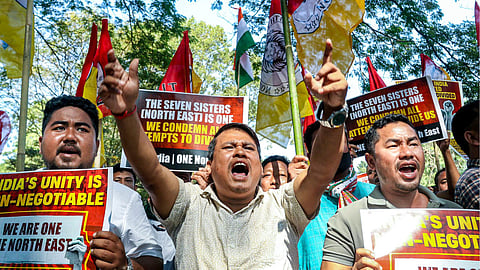 Members of Tipra Motha Party's youth wing stage a demonstration to protest Bangladesh's alleged 'anti-India campaign' and remarks made by a leader of the neighbouring country about the Northeast, near Bangladesh Assistant High Commission, in Agartala, Friday, Dec. 19, 2025.