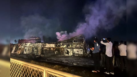 Charred remains of a bus after it caught fire following a collision with a speeding truck, in Chitradurga, early Thursday, Dec. 25, 2025. At least nine persons were killed in the incident