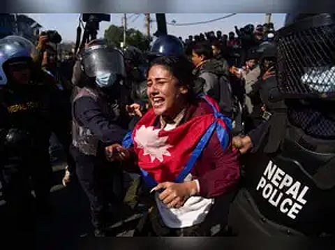 Nepalese police detain a protester during an anti-government rally in Kathmandu, Nepal, Dec. 22, 2025