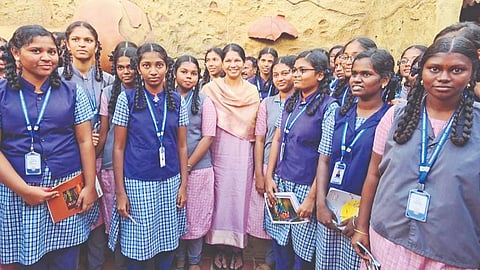 MP Kanimozhi flanked by students from government schools
at the Keezhadi museum in Sivaganga on Saturday