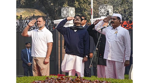 Lok Sabha and Congress leader Rahul Gandhi, party MP KC Venugopal and others during the flag-hoisting ceremony marking the 140th Foundation Day of the party, at Indira Bhawan in New Delhi.