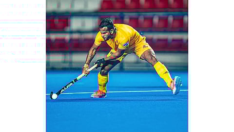 Amit Rohidas takes a shot during training session