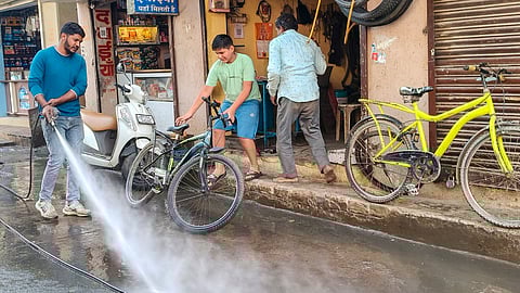 Indore Municipal Corporation workers conduct a cleanliness drive after several people were affected due to consumption of contaminated water at Bhagirathpura area, in Indore, Madhya Pradesh
