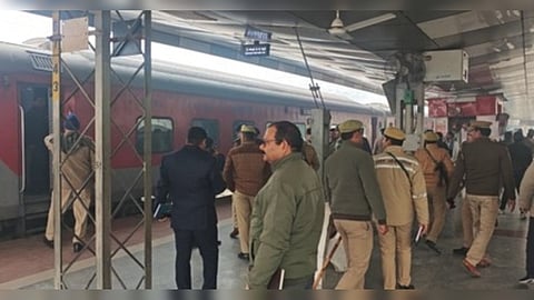 Police inspects the coaches after receiving a bomb threat.