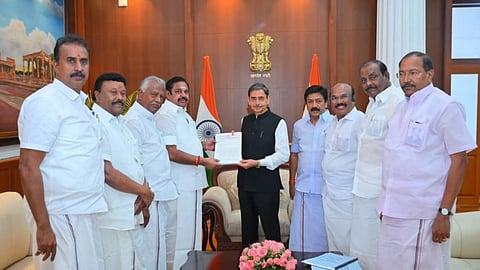 AIADMK general secretary Edappadi Palaniswami handing over a dossier to Governor RN Ravi at Lok Bhavan on Tuesday
