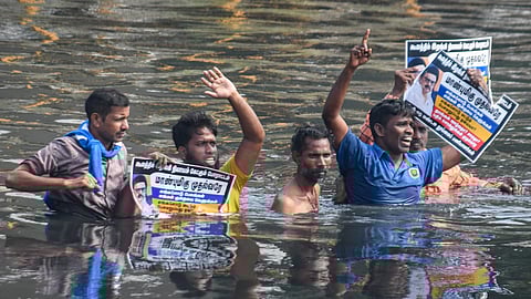 Cleanliness workers protesting in the Cooum river