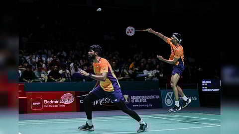 Chirag Shetty leaps to return a serve during the match