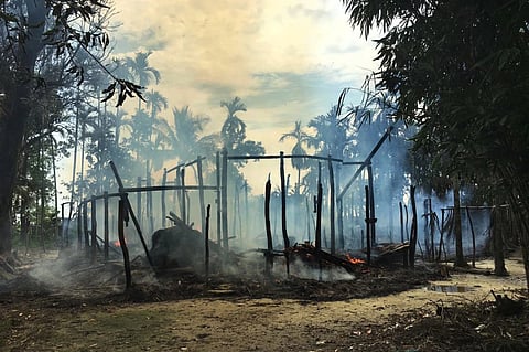 Smoke rises from a burned house in Rohingya