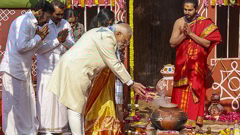 Prime Minister Modi performs rituals as Union Ministers G Kishan Reddy and L Murugan look on during Pongal celebrations in New Delhi