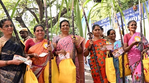 Women seen receiving their Pongal gift hamper