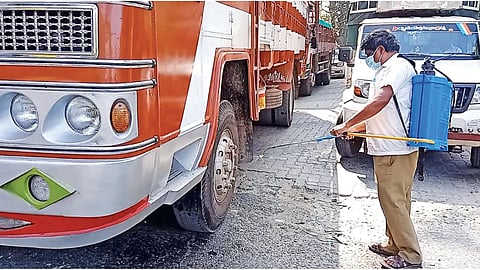 Vehicles are disinfected at border checkpoints to stop the spread of zoonotic diseases