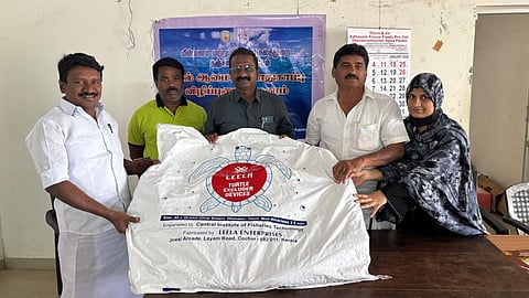 The fishermen with a turtle excluder device in Thanjavur on Monday/