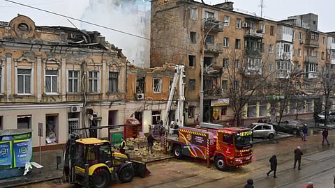 Rescue workers clear the rubble of a residential building which was heavily damaged after a Russian strike in Odesa, Ukraine