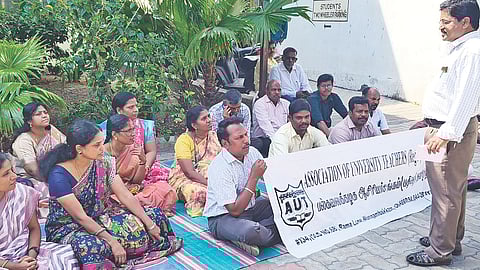 Professors at a sit-in protest in city demanding CAS