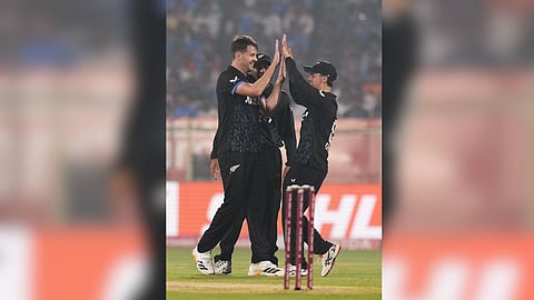New Zealand's Jacob Duffy, (L), celebrates with teammates after taking the catch of Indian captain Suryakumar Yadav during the fourth T20I cricket match between India and New Zealand, at ACA-VDCA Cricket Stadium, in Visakhapatnam, Andhra Pradesh