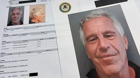 Documents that were included in the U.S. Department of Justice release of the Jeffrey Epstein files are photographed