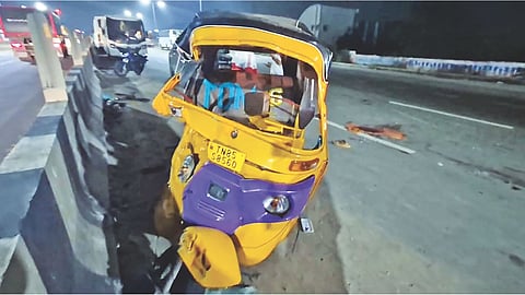 Mangled remains of autorickshaw crushed by lorry on Chennai-Bengaluru National Highway near Sriperumbudur