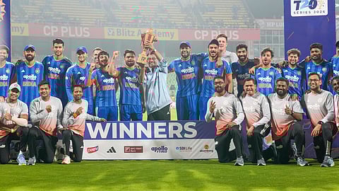 Indian team members and support staff celebrate with the championship trophy during the presentation ceremony after winning the T20 International cricket match series against New Zealand, at the Greenfield International Stadium, in Thiruvananthapuram, Kerala, Saturday, Jan. 31, 2026.