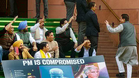Congress MPs Gurjeet Singh Aujla, Hibi Eden, B. Manickam Tagore, CPI(M) MP S Venkatesan and other MPs who were suspended from the Lok Sabha on Tuesday for the remainder of the Budget session for "unruly behaviour'', stage a protest with a poster 'PM is compromised', at Parliament premises in New Delhi, Wednesday, Feb. 4, 2026. Union Minister Piyush Goyal also seen
