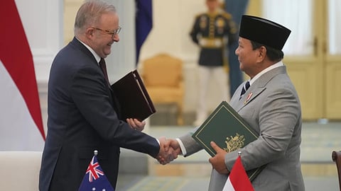 Australian Prime Minister Anthony Albanese, left, shakes hands with Indonesian President Prabowo Subianto at the end of a document signing ceremony at Merdeka Palace in Jakarta, Indonesia