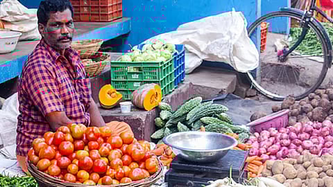Image of man selling vegetables used for representative purpose