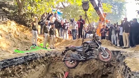 A 15-foot-deep pit dug for sewage work by the Delhi Jal Board (DJB), where a motorcyclist died after falling, barricaded during investigation by police, at Janakpuri area, in New Delhi, Friday, Feb. 6, 2026