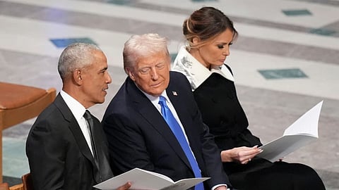 Former President Barack Obama (L) talks with then President-elect Donald Trump, Melania Trump (R)
