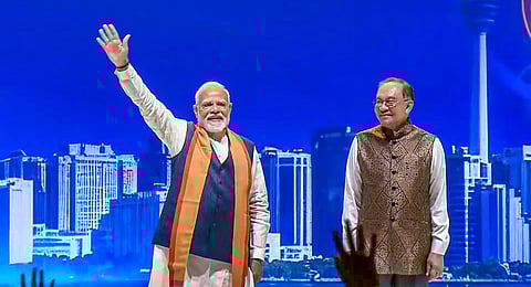 Prime Minister Narendra Modi along with his Malaysian counterpart Anwar Ibrahim participates in a community programme, in Kuala Lumpur, Malaysia.